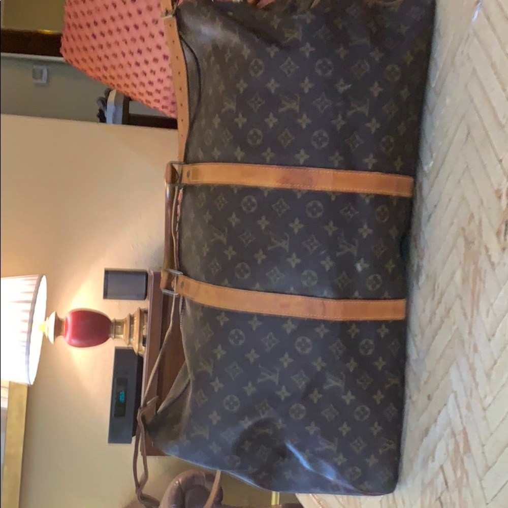 Louis Vuitton luggage. 22” in length 11” wide